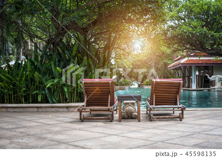 Beautiful sunbed chair near the swimming pool Beautiful sunbed chair near the swimming pool 45598135