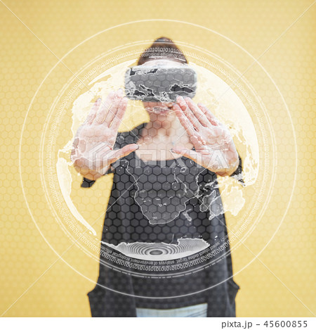 Happy woman in the studio gets the experience of using VR-glasses virtual reality headset 45600855