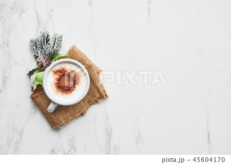 Hot cocoa drink or eggnog. 45604170