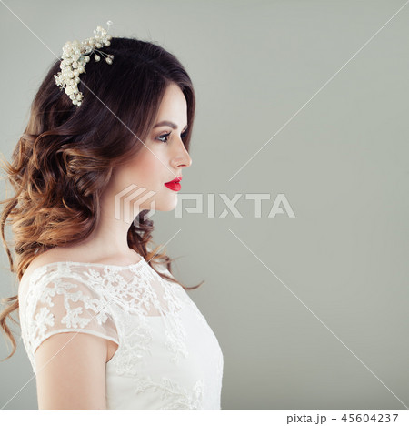 Charming young woman bride with wavy hairstyle Charming young woman bride with wavy hairstyle 45604237
