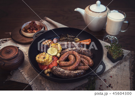 Grilled sausages with vegetables Grilled sausages with vegetables 45604300