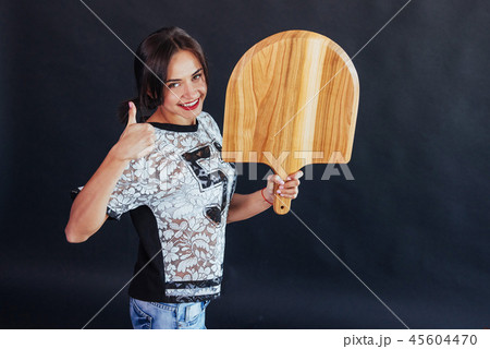 Beautiful young woman with a wooden board 45604470