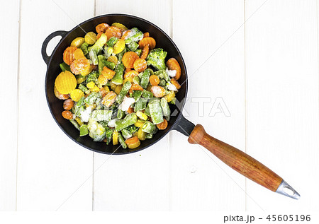 Frying pan with frozen vegetables 45605196