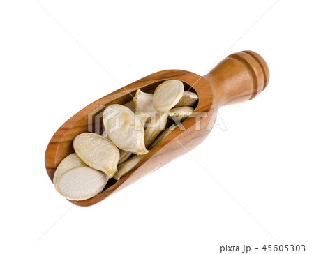 Dry pumpkin seeds in wooden scoop, isolated on white background 45605303