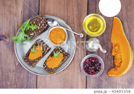 Vegetable caviar from pumpkin and zucchini on wooden table 45605356