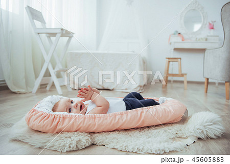 Bedding for children. The baby sleeps in bed. A healthy little baby soon after birth. Bedding for children. The baby sleeps in bed. A healthy little baby soon after birth. 45605883