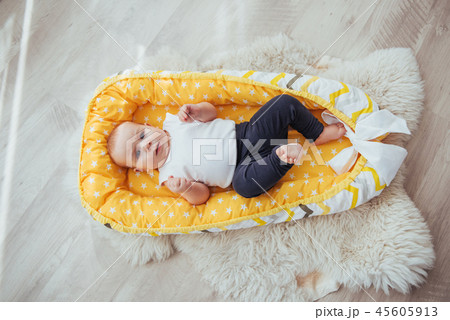 Bedding for children. The baby sleeps in bed. A healthy little baby soon after birth. Bedding for children. The baby sleeps in bed. A healthy little baby soon after birth. 45605913