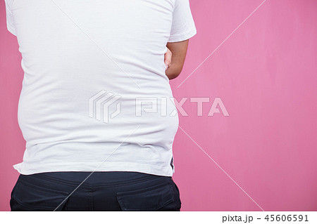 glutton, junk food. Fat obese man, back view 45606591