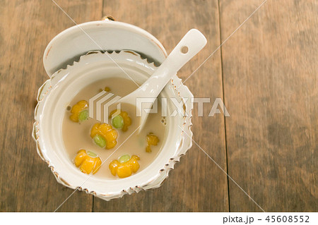 Pumpkin shape of sticky rice balls in coconut milk 45608552
