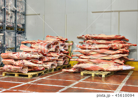 Frozen beef carcasses are stacked on pallets Frozen beef carcasses are stacked on pallets 45610094