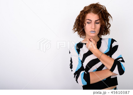 Portrait Of Young Woman Thinking Against White Background Portrait Of Young Woman Thinking Against White Background 45610387