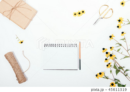 Floral flat lay composition with empty sketchbook Floral flat lay composition with empty sketchbook 45611319