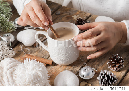 Girl sitting at her desk drinking coffee 45611741