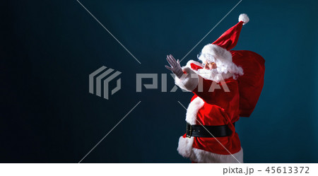 Santa holding a red sack 45613372