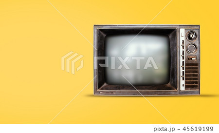Old vintage tv on yellow background 45619199