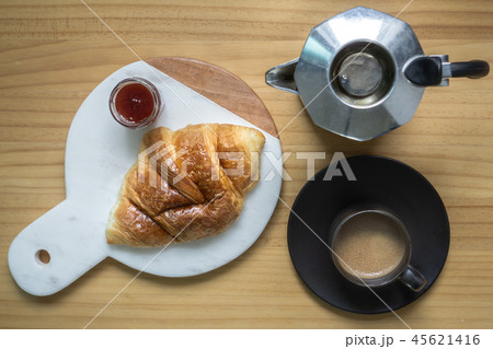 Black coffee with creama , Moka pot and croissant Black coffee with creama , Moka pot and croissant 45621416
