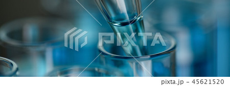 Test tube of glass overflows liquid solution potassium Test tube of glass overflows liquid solution potassium 45621520