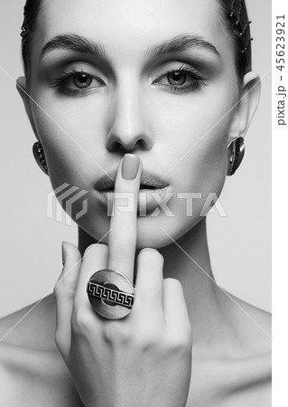 beautiful girl showing finger with ring 45623921