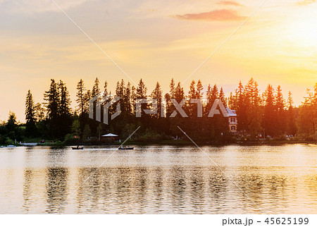 Sunset over the lake. Majestic mountain lake in National Park High Tatra. Strbske pleso, Slovakia Sunset over the lake. Majestic mountain lake in National Park High Tatra. Strbske pleso, Slovakia 45625199