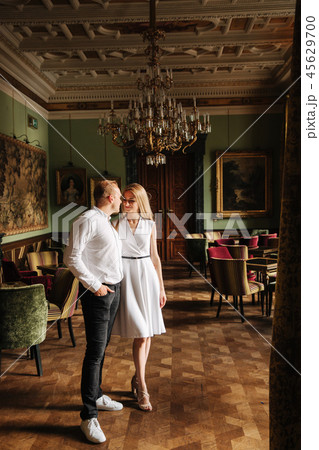 Young couple stand in they apatrament near the big window 45629700