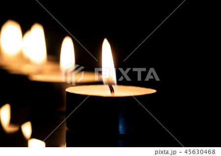 Candle flame on the background of other candles 45630468