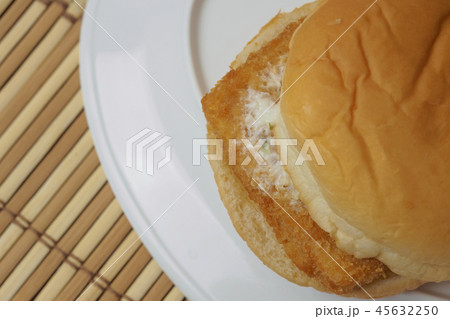 Low cost burger fish steak on bamboo mat Low cost burger fish steak on bamboo mat 45632250