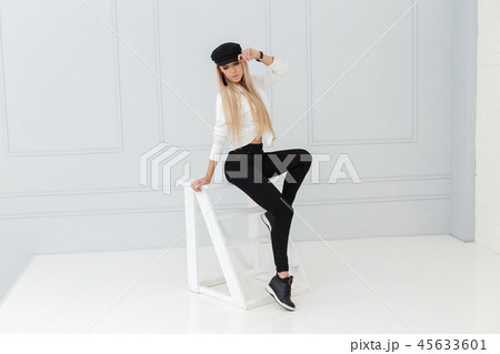 Fashion portrait of women in black and white suit Fashion portrait of women in black and white suit 45633601