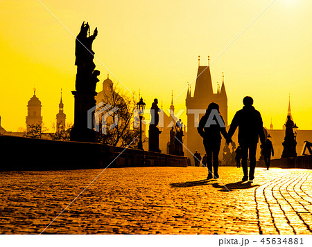 Foggy morning on Charles Bridge, Prague, Czech Republic. Sunrise with silhouettes of walking people Foggy morning on Charles Bridge, Prague, Czech Republic. Sunrise with silhouettes of walking people 45634881