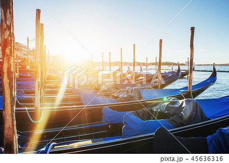 Gondolas in Venice - sunset with San Giorgio Maggiore church. Venice, Italy Gondolas in Venice - sunset with San Giorgio Maggiore church. Venice, Italy 45636316