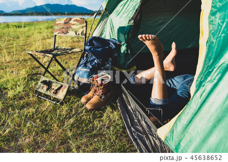 Close up of woman legs relaxing in camping tent 45638652