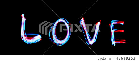 Glowing inscription LOVE on a black background Glowing inscription LOVE on a black background 45639253
