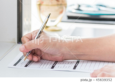 Physician doctor writing on medical record Physician doctor writing on medical record 45639352