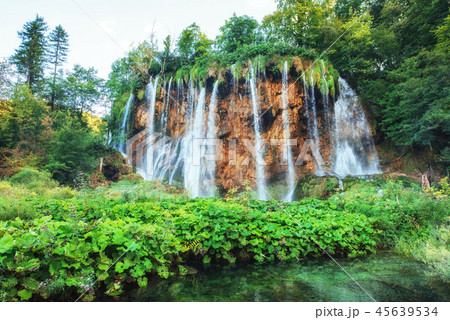Waterfalls in national park falling into turquoise lake. Plitvice, Croatia Waterfalls in national park falling into turquoise lake. Plitvice, Croatia 45639534