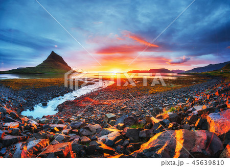 The picturesque sunset over landscapes and waterfalls. Kirkjufell mountain Iceland 45639810