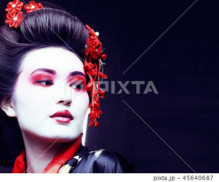 young pretty real geisha in kimono with sakura and decoration on 45640687