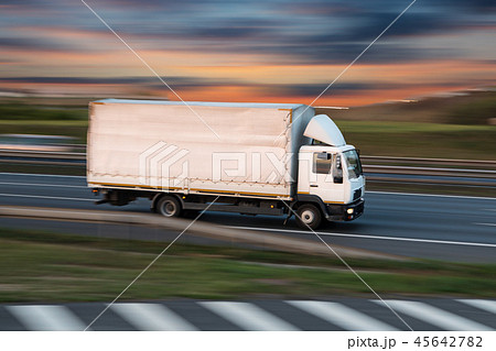 Truck with container on road, cargo transportation concept. Truck with container on road, cargo transportation concept. 45642782