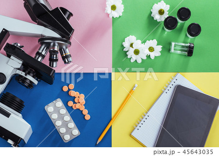 view from the mountain microscope with tablets and notebook on a colored background. 45643035