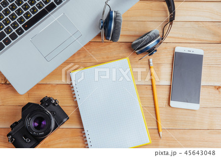 Top view of notebook, stationery, drawing tools and a few glasses. improvise. Top view of notebook, stationery, drawing tools and a few glasses. improvise. 45643048