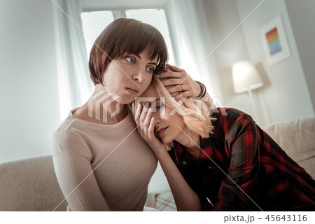 Same sex couple being overwhelmed with grief 45643116