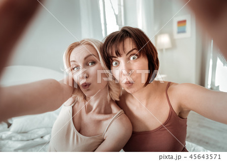 Interesting sweet couple making some funny faces 45643571