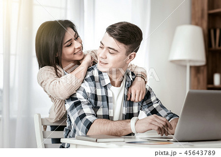 Positive delighted young female looking at her boyfriend Positive delighted young female looking at her boyfriend 45643789