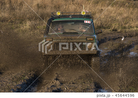 Offroad car overcomes the track Offroad car overcomes the track 45644596