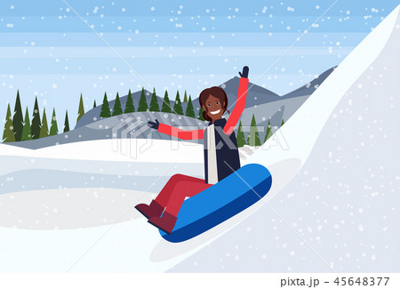 african american woman sledding on snow rubber tube winter vacation activity concept snowy mountains 45648377