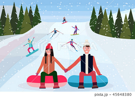 couple sledding on snow rubber tube over snowboarders skiers people sliding down snowy mountain hill 45648380