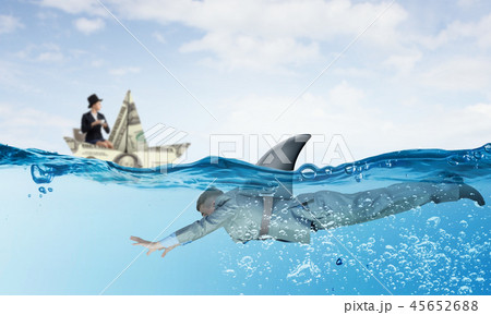 Businesswoman in boat made of dollar banknote 45652688
