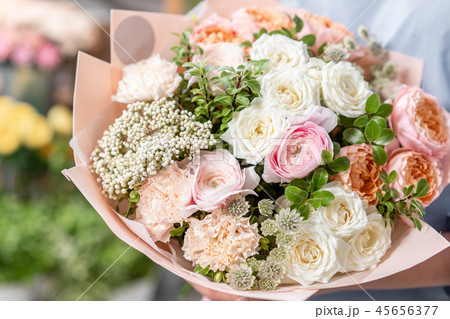 European floral shop. Bouquet of beautiful Mixed flowers in woman hand. Excellent garden flowers in 45656377