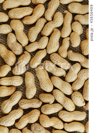 Peanuts in their shell textured food background. 45656409