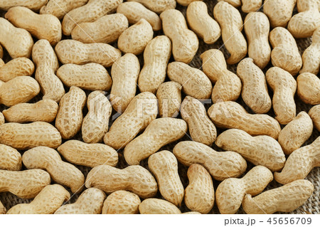 Peanuts in their shell textured food background. Peanuts in their shell textured food background. 45656709