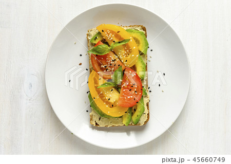 Avocado and tomato toast on plate with copy space Avocado and tomato toast on plate with copy space 45660749
