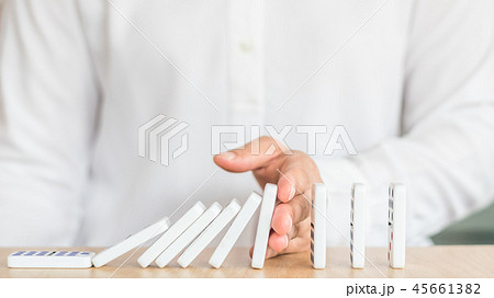 Stoping domino effect concept for business  45661382